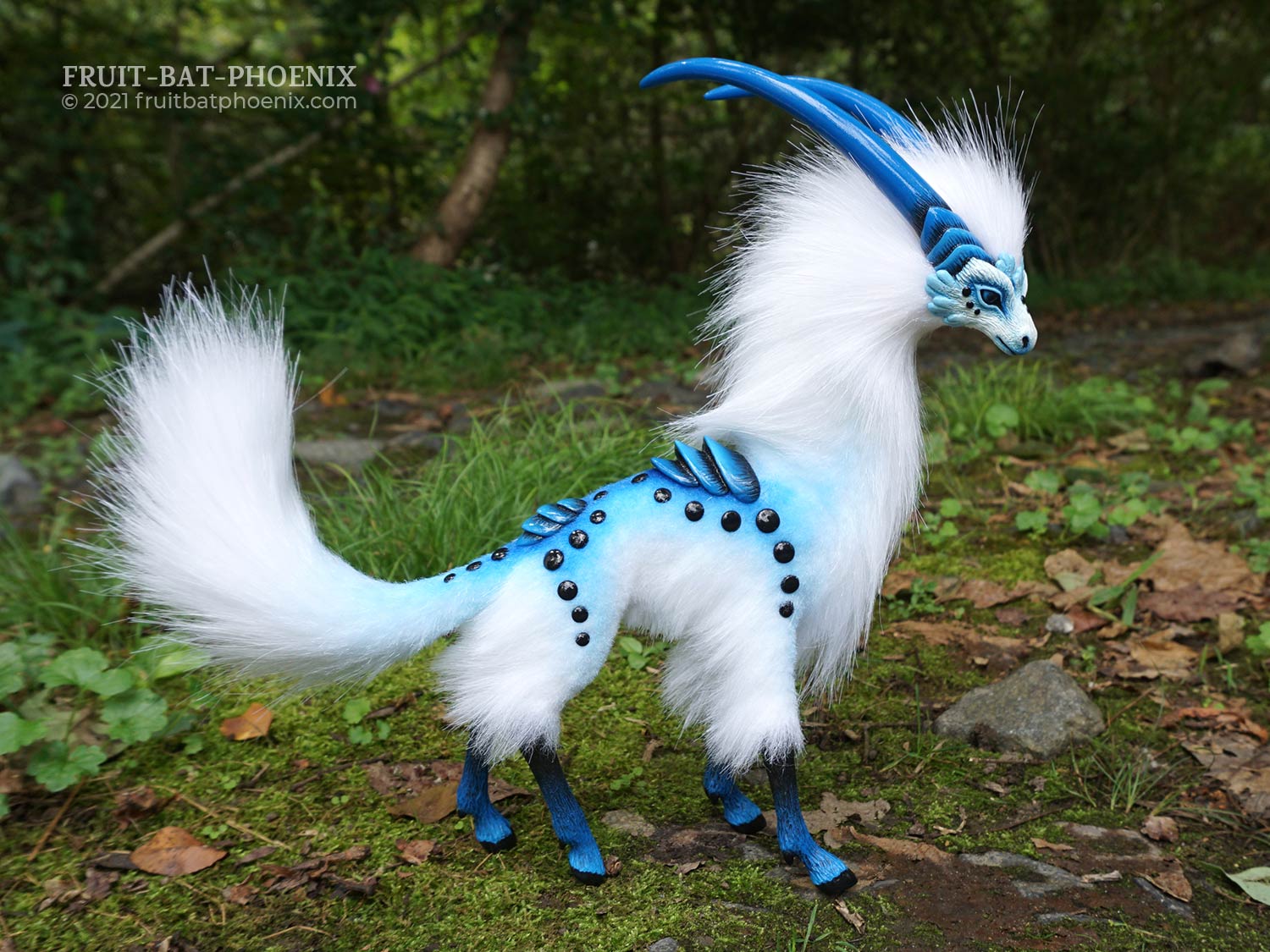Cloud Antelope III, a white and blue graceful horned creature