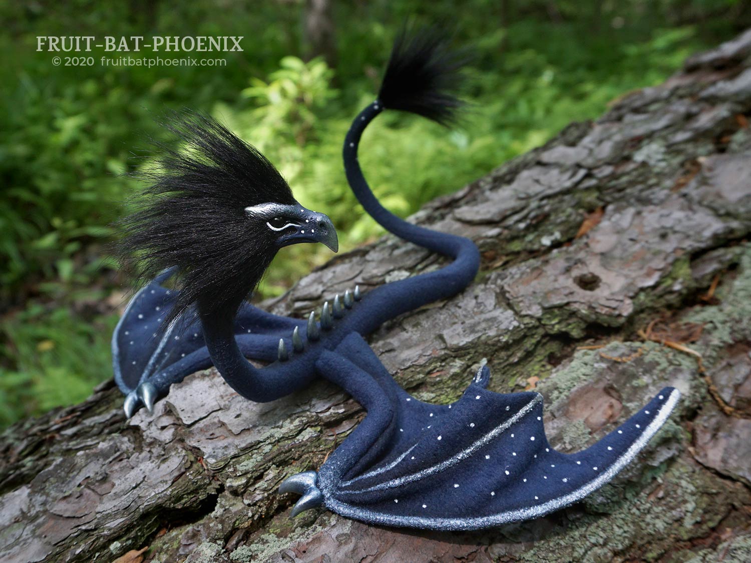 starlight eagle wyrm dragon on a fallen log