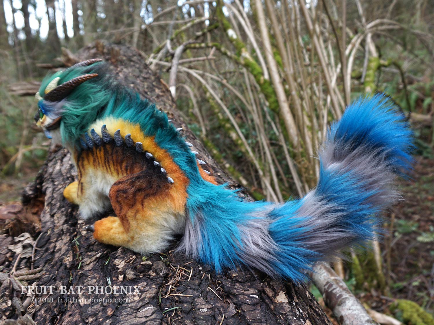 prismatic kitten-dragon back view